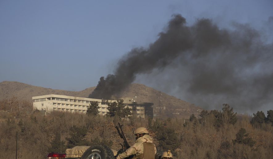 Black smoke rises from the Intercontinental Hotel after an attack in Kabul, Afghanistan, Sunday, Jan. 21, 2018. Gunmen stormed the hotel in the Afghan capital on Saturday evening, triggering a shootout with security forces, officials said. (AP Photo/Rahmat Gul)