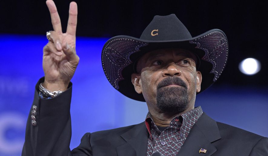 FILE - In this Feb. 23, 2017, file photo, Milwaukee County Sheriff David Clarke speaks at the Conservative Political Action Conference (CPAC) in Oxon Hill, Md. The former Milwaukee Sheriff’s run-in with a man who shook his head at him while boarding a flight last year is headed for trial in federal court Monday, Jan. 22, 2018. (AP Photo/Susan Walsh File)