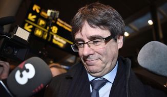 Ousted Catalan leader Carles Puigdemont, left, arrives in Copenhagen on Monday, Jan. 22, 2018. The fugitive former leader of Catalonia has arrived in Denmark, despite threats from Spain to seek his immediate arrest there. Puigdemont is being investigated by Spain over a unilateral declaration of independence by Catalonia&#39;s parliament on Oct. 27. (Tariq Mikkel Khan/Ritzau Scanpix via AP)