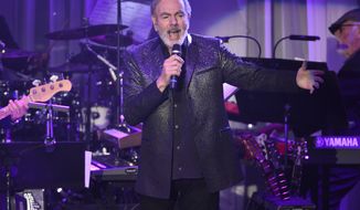 FILE- This Feb. 11, 2017, file photo shows Neil Diamond performing at the Clive Davis and The Recording Academy Pre-Grammy Gala at the Beverly Hilton Hotel in Beverly Hills, Calif. Diamond is retiring from touring after he says he was diagnosed with Parkinsons disease. Diamond turns 77 on Wednesday. Jan. 24, 2018. (Photo by Chris Pizzello/Invision/AP, File)