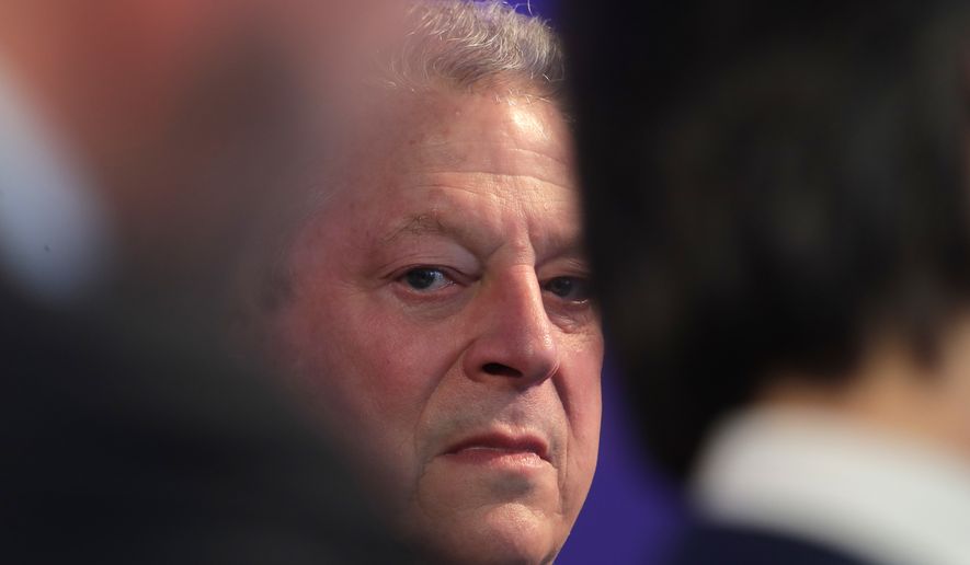 Former U.S. Vice President Al Gore waits for the beginning of the ceremony for the Crystal Awards on the eve of annual meeting of the World Economic Forum in Davos, Switzerland, Monday, Jan. 22, 2018. The award celebrates the achievements of leading artists who are bridge-builders and role models for all leaders of society. (AP Photo/Markus Schreiber)