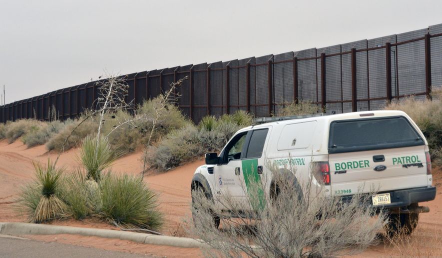 In this Jan. 5, 2016, file photo, a U.S. Border Patrol vehicle drives next to a U.S-Mexico border fence in the booming New Mexico town of Santa Teresa. The Trump administration is waiving numerous laws to clear the way for replacing existing vehicle barriers along a stretch of the US-Mexico border in New Mexico. The notice published Monday, Jan. 22, 2018, in the Federal Register says the waiver extends around 20 miles west of the Santa Teresa Port of Entry. (AP Photo/Russell Contreras, File)