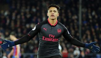 FILE - In this Thursday, Dec. 28, 2017 file photo, Arsenal&#x27;s Alexis Sanchez celebrates after scoring his side&#x27;s third goal of the game during their English Premier League soccer match against Crystal Palace at Selhurst Park stadium in London. Alexis Sanchez is close to joining Manchester United in what is set to be a rare swap deal among two of England’s top teams that will see Henrikh Mkhitaryan move to Arsenal. Both players were pictured by British newspapers Monday, Jan. 22, 2018 entering an office in Liverpool to update their work permits. (AP Photo/Alastair Grant, file)
