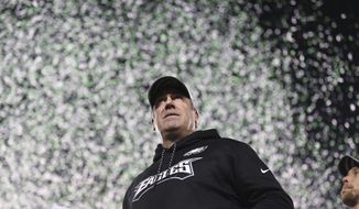 Philadelphia Eagles coach Doug Pederson looks out over the crowd as confetti falls after the team&#x27;s 38-7 win over the Minnesota Vikings during the NFC championship NFL football game Sunday, Jan. 21, 2018, in Philadelphia. (David Maialetti/The Philadelphia Inquirer via AP)
