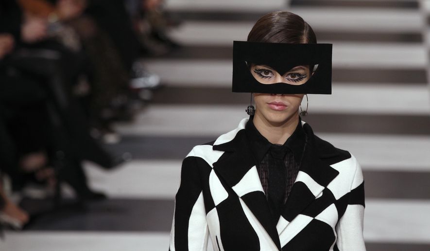 A model wears a creation for the Christian Dior Haute Couture Spring-Summer 2018 fashion collection presented in Paris, Monday, Jan. 22, 2018. (AP Photo/Francois Mori)