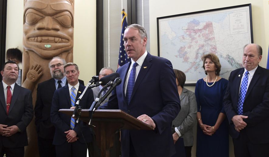 At an emotional ceremony Monday, Interior Secretary Ryan Zinke signed an agreement for a land exchange that will allow construction of a road between King Cove and an all-weather airport in Cold Bay. (Associated Press)