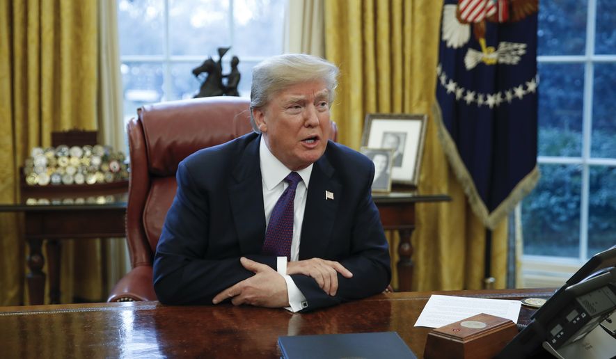 President Donald Trump speaks to media in the Oval Office of the White House in Washington, Tuesday, Jan. 23, 2018. (AP Photo/Carolyn Kaster)