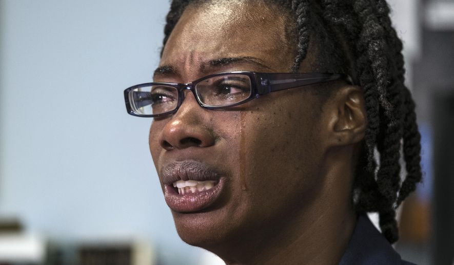 FILE - In this July 19, 2016 file photo, Breaion King is overcome with emotion as she describes being pulled from her car and thrown to the ground by an Austin police officer during a traffic stop in 2015 in Austin, Texas. Austin police officer Bryan Richter who was reprimanded for the violent arrest of King, has been fired for his conduct in another arrest. Richter's dismissal Monday Jan. 22, 2018, stems from a case in which he and other officers were serving a warrant six months ago. (Rodolfo Gonzalez/Austin American-Statesman via AP File)