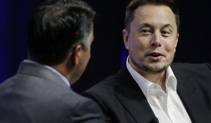 FILE - In this July 15, 2017, file photo, Tesla and SpaceX CEO Elon Musk responds to a question by Nevada Republican Gov. Brian Sandoval during the closing plenary session entitled "Introducing the New Chairs Initiative - Ahead" on the third day of the National Governors Association's meeting in Providence, R.I. Tesla says it’s put together a 10-year compensation package for Musk that pays him based on certain market cap and operational milestones he hits - otherwise he gets nothing. The electric vehicle maker says Tuesday, Jan. 23, 2018, its market cap would have to grow to $650B for Musk to fully vest. (AP Photo/Stephan Savoia, File)