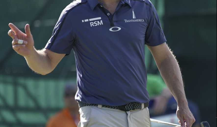FILE - In this Jan. 11, 2018, file photo, Zach Johnson waves to the gallery off the eight green during the first round of the Sony Open golf tournament in Honolulu. Johnson is optimistic about ending his two-year drought without a victory. (AP Photo/Marco Garcia, File)