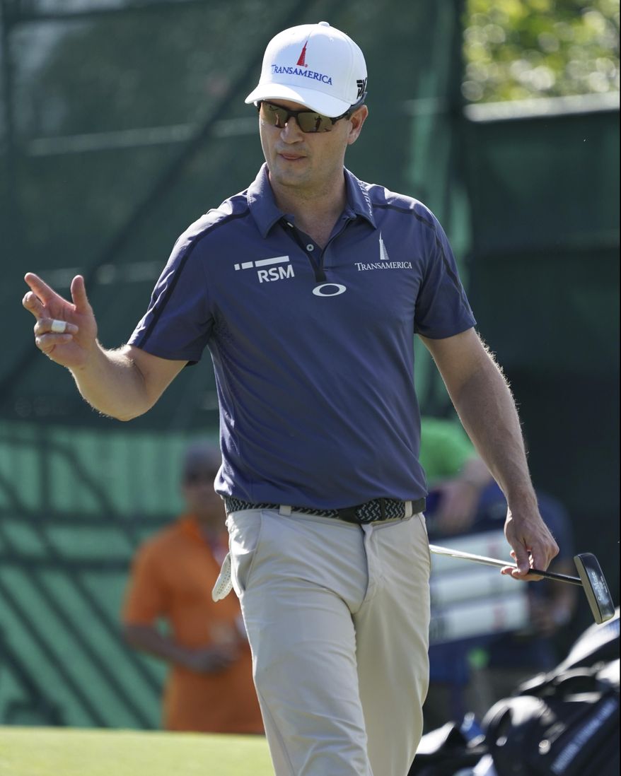 FILE - In this Jan. 11, 2018, file photo, Zach Johnson waves to the gallery off the eight green during the first round of the Sony Open golf tournament in Honolulu. Johnson is optimistic about ending his two-year drought without a victory. (AP Photo/Marco Garcia, File)