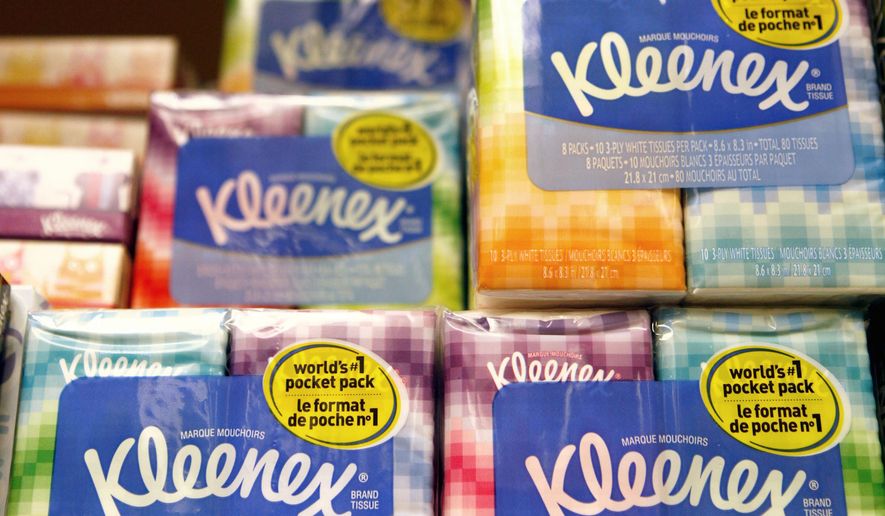 FILE - This Jan. 20, 2011, file photo shows packages of Kleenex tissues, a Kimberly Clark brand, at a store in San Francisco. Kimberly-Clark is cutting 5,000 to 5,500 jobs, or 12 percent to 13 percent of its workforce, as the consumer products company tries to lower costs. The Huggies and Kleenex maker said Tuesday, Jan. 23, 2018, that it plans to close or sell about 10 manufacturing plants while expanding production elsewhere. (AP Photo/Jeff Chiu, File)