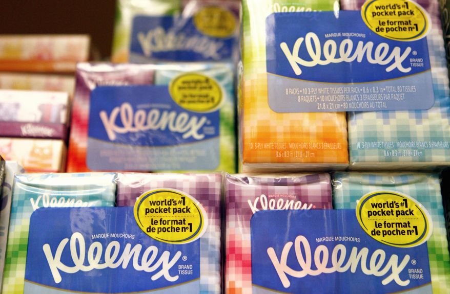 FILE - This Jan. 20, 2011, file photo shows packages of Kleenex tissues, a Kimberly Clark brand, at a store in San Francisco. Kimberly-Clark is cutting 5,000 to 5,500 jobs, or 12 percent to 13 percent of its workforce, as the consumer products company tries to lower costs. The Huggies and Kleenex maker said Tuesday, Jan. 23, 2018, that it plans to close or sell about 10 manufacturing plants while expanding production elsewhere. (AP Photo/Jeff Chiu, File)