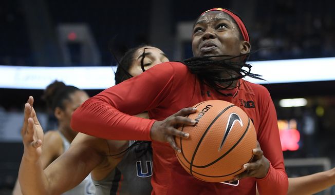 In this Nov. 19, 2017, file photo, Maryland's Kaila Charles, right, turns to shoot as Connecticut's Gabby Williams, back, defends during the first half an NCAA college basketball game, in Hartford, Conn. (AP Photo/Jessica Hill, File) ** FILE **