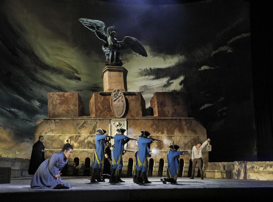 This image released by the Metropolitan Opera shows a performance of “Tosca” in New York. The wings in all their glory will be on display in movie theaters around the world on Saturday, Jan. 27, when “Tosca” is broadcast as part of the Met's Live in HD series. (Ken Howard/Metropolitan Opera via AP)