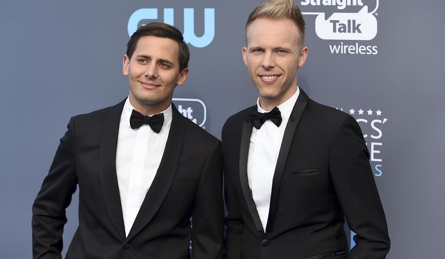FILE - In this Jan. 11, 2018 file photo, Benj Pasek, left, and Justin Paul arrive at the 23rd annual Critics' Choice Awards in Santa Monica, Calif. The pair were nominated for an Oscar for best original song for "This Is Me," from the film "The Greatest Showman." (Photo by Jordan Strauss/Invision/AP, File)