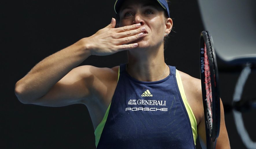 Germany's Angelique Kerber blows the kisses to the crowd after defeating United States' Madison Keys in their quarterfinal at the Australian Open tennis championships in Melbourne, Australia, Wednesday, Jan. 24, 2018. (AP Photo/Ng Han Guan)