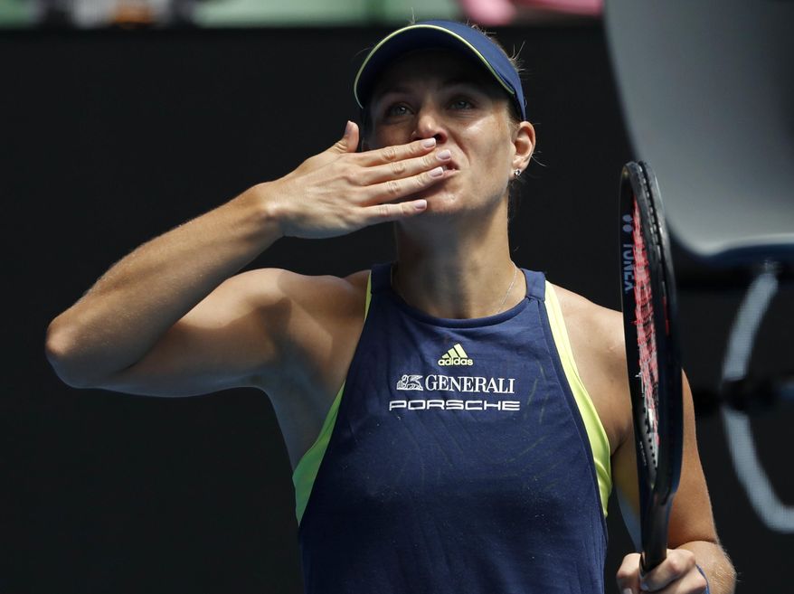 Germany's Angelique Kerber blows the kisses to the crowd after defeating United States' Madison Keys in their quarterfinal at the Australian Open tennis championships in Melbourne, Australia, Wednesday, Jan. 24, 2018. (AP Photo/Ng Han Guan)