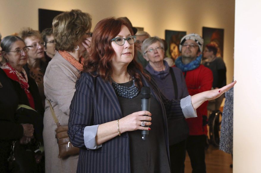 In a Jan. 20, 2018 photo, Mary Solberg talks about her water portraits during a presentation at the Minnesota Marine Art Museum in Winona, Minn. (Andrew Thoreson/The Winona Daily News via AP)