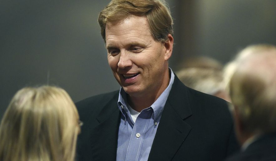 FILE - In this Nov. 8, 2016, file photo, South Dakota State Rep. G. Mark Mickelson talks with attendees at the Minnehaha GOP Republican election party in Sioux Falls, S.D. A measure that would ask voters to give South Dakota lawmakers a significant pay raise cleared its first legislative hurdle Wednesday, Jan. 24, 2018. House Speaker Mickelson, a supporter, said the proposal would tie lawmakers' salaries to the economic prospects of the people they represent. (Jay Pickthorn/The Argus Leader via AP, File)