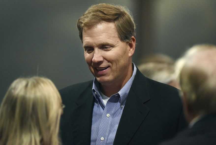 FILE - In this Nov. 8, 2016, file photo, South Dakota State Rep. G. Mark Mickelson talks with attendees at the Minnehaha GOP Republican election party in Sioux Falls, S.D. A measure that would ask voters to give South Dakota lawmakers a significant pay raise cleared its first legislative hurdle Wednesday, Jan. 24, 2018. House Speaker Mickelson, a supporter, said the proposal would tie lawmakers' salaries to the economic prospects of the people they represent. (Jay Pickthorn/The Argus Leader via AP, File)