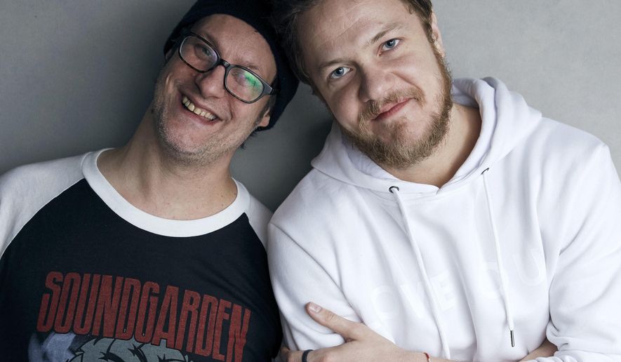 Director Don Argott, left, and Dan Reynolds pose for a portrait to promote the film, &quot;Believer,&quot; at the Music Lodge during the Sundance Film Festival on Sunday, Jan. 21, 2018, in Park City, Utah. The Mormon frontman of the Imagine Dragons rock band hopes the Sundance Film Festival documentary that follows his journey to becoming an advocate for LGBT Mormon youth triggers real change by his religion’s leaders and puts an end to what he calls shaming of gay and lesbian kids in the religion. (Photo by Taylor Jewell/Invision/AP)