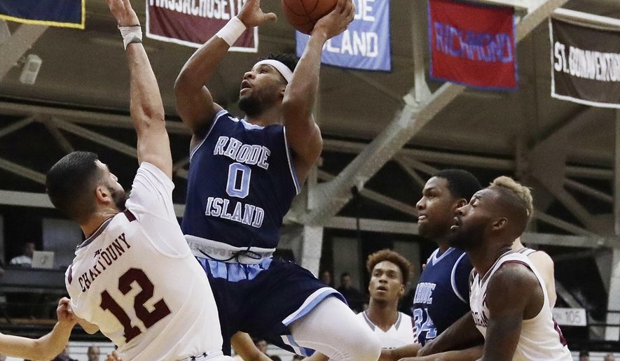 Rhode Island's E.C. Matthews (0) shoots over Fordham's Joseph Chartouny (12) during the first half of an NCAA college basketball game Wednesday, Jan. 24, 2018, in New York. (AP Photo/Frank Franklin II)