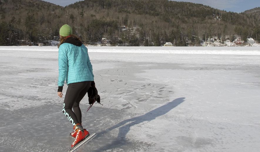 In this Jan. 20, 2018 photo, a skater wearing Nordic skates strides along on a 4.5-mile trail around Lake Morey in Fairlee, Vt., said to be the longest Nordic ice skating trail in the United States. (AP Photo/Lisa Rathke)