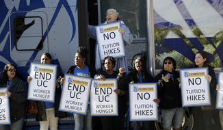 File - In this Jan. 25, 2107, file photo, University of California employees, who are also members of the Teamsters Local 210, shout in protest against cuts in their benefits and tuition hikes outside of a University of California Board of Regents meeting in San Francisco. The University of California&#39;s governing board is scheduled to vote Wednesday, Jan. 24, 2018, on a plan to raise tuition for the second consecutive year after Gov. Jerry Brown proposed a budget increase of 3 percent and urged university officials to &amp;quot;live within their means.&amp;quot; (AP Photo/Marcio Jose Sanchez, File)