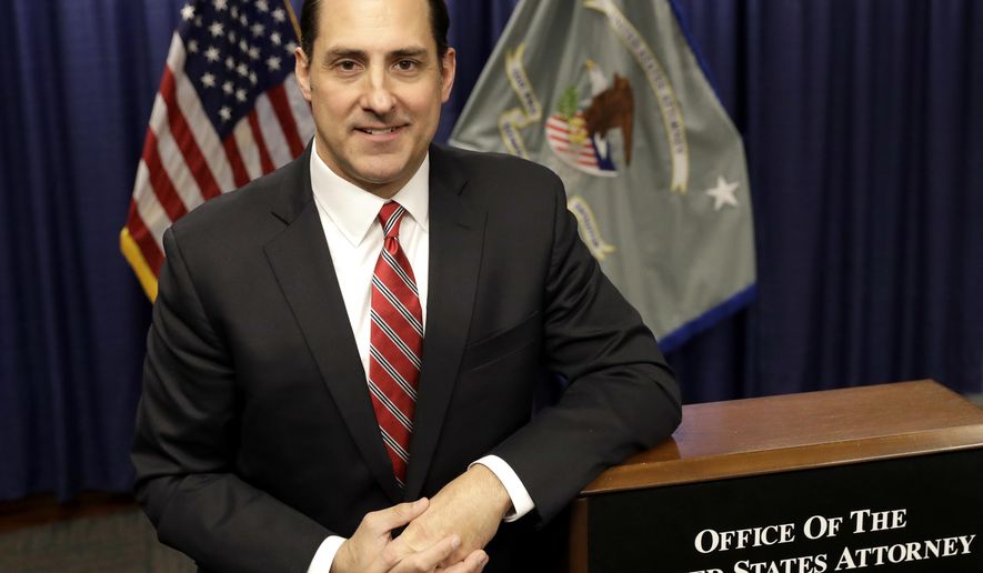 John R. Lausch Jr., the new U.S. attorney for the Northern District of Illinois, poses for a portrait after meeting with reporters for the first time Wednesday, Jan. 24, 2018, in Chicago. Lausch says President Donald Trump never tried to speak to him before the president nominated him for the position and told reporters on Wednesday, that he has still not spoken to the president and has not been given any instructions by Attorney General Jeff Sessions to change the priorities of the office. (AP Photo/Charles Rex Arbogast)