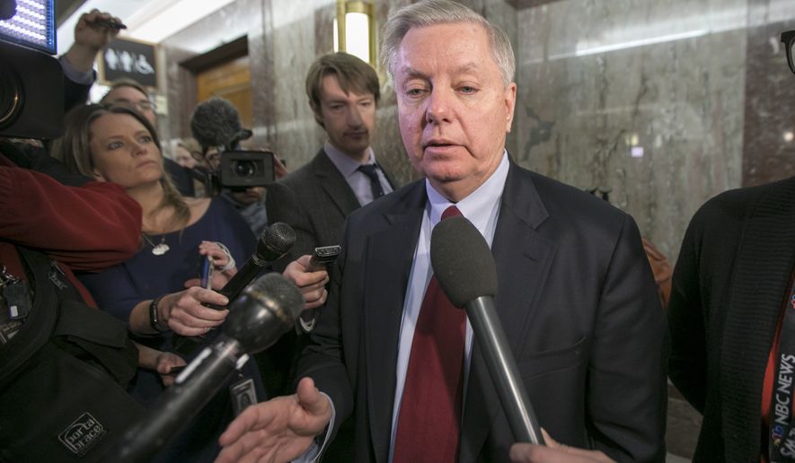 Sen. Lindsey Graham, R-S.C., speaks to reporters as he leaves the office of Sen. Susan Collins, R-Maine, who is moderating bipartisan negotiations on immigration, at the Capitol in Washington, Thursday, Jan. 25, 2018. (AP Photo/J. Scott Applewhite)