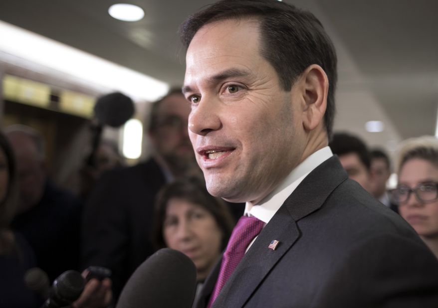 Sen. Marco Rubio, R-Fla., speaks with reporters as he leaves the office of Sen. Susan Collins, R-Maine, who is moderating bipartisan negotiations on immigration, at the Capitol in Washington, Thursday, Jan. 25, 2018. President Donald Trump has given Congress until March to come up with a plan to protect the nearly 700,000 young people who had been protected from deportation and given the right to work legally in the country under the Obama-era Deferred Action for Childhood Arrivals program, or DACA. Mr. Trump announced in 2017 he was ending DACA. (AP Photo/J. Scott Applewhite)