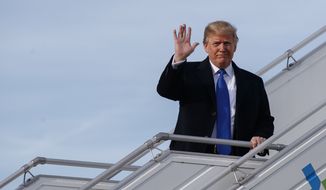 U.S. President Donald Trump alights from Air Force One at Zurich International Airport for the Davos World Economic Forum, Thursday, Jan. 25, 2018, in Zurich, Switzerland.  Trump is attending the annual gathering for free-trade-loving political and business elites at the Davos economic summit in the Swiss Alps.(AP Photo/Evan Vucci)
