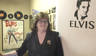 In this Jan. 5, 2018 photo, hairstylist Jackie Wagher stands at the entrance to her hair salon,  Jackie&#39;s Hair Care in her home in Knoxville, Ill. Wagher, a big Elvis fan, has adorned her salon and home with Elvis memorabilia. &amp;quot;Elvis was the first man I loved. I remember Elvis was the man I wanted to marry.&amp;quot; Wagner said. By the age of 15 Wagher started collecting Elvis keep sakes. (Tom Loewy/The Register-Mail, via AP)