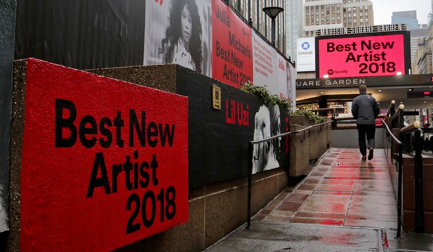Signs posted around Madison Square Garden promote the return of the Grammy Awards to New York, Tuesday, Jan. 23, 2018, in New York. The Grammy Awards will be held on Sunday. (AP Photo/Bebeto Matthews)