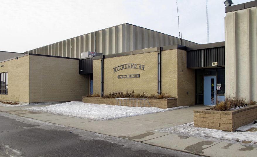 This Wednesday, Jan . 24, 2018, photo, shows an entrance to Richland High School in Colfax, N.D., where authorities are investigating alleged student misbehavior. School district Superintendent Tim Godfrey says the alleged misbehavior happened in the boys' locker room for seventh through 12th-graders. He says it might have involved sexual harassment. The Richland County Sheriff's Department is investigating. (AP Photo/Dave Kolpack)