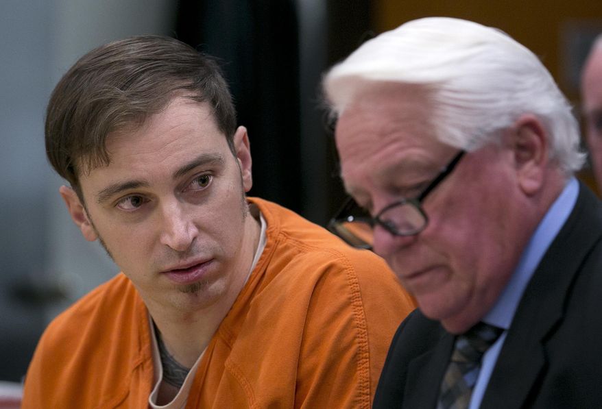 William Scott Planer, left, talks with his attorney, Danny Brace, during a preliminary hearing into an assault charge he faces stemming from a 2016 melee at the state Capitol, in Sacramento County Superior Court, Friday, Jan. 26, 2018, in Sacramento, Calif. Planer, 35, a member of a white-nationalist group, has been ordered to stand trial for assault with a deadly weapon when he struck a counter-protestor from behind knocking her unconscious. (AP Photo/Rich Pedroncelli)