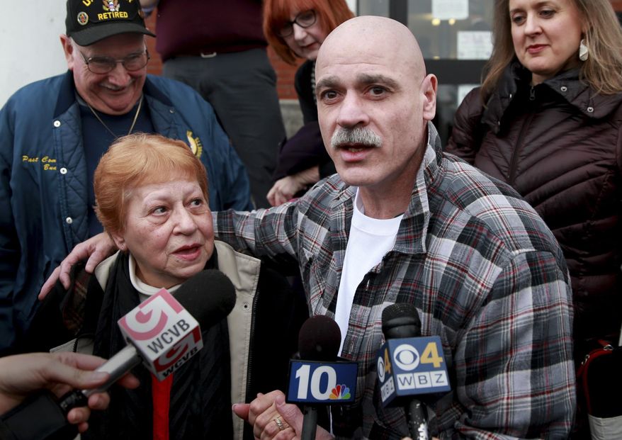 FILE - In this Feb. 10, 2016 file photo, George Perrot, right, with his mother Beverly Garrant, talks to the media in front of the Bristol County Superior Court after he was released following his bail hearing in New Bedford, Mass. His stepfather Robert Garrant is at left. On Thursday, Jan. 25, 2018, Perrot, who spent three decades in prison for a rape he said he did not commit, sued law enforcement officers and agencies he alleges conspired to frame him. (Jonathan Wiggs/The Boston Globe via AP, File)