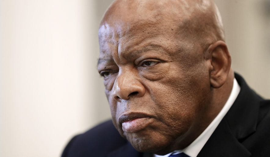 FILE - In this Friday, Nov. 18, 2016 file photo, Rep. John Lewis, D-Ga., is interviewed at the Nashville Public Library in Nashville, Tenn. Dante Antione Rosser, a man accused of threatening the staff of U.S. Rep. John Lewis has pleaded guilty in federal court. Rosser pleaded guilty Friday, Jan. 26, 2018 to a charge of threatening a federal official. Prosecutor Phyllis Clerk said Rosser’s plea agreement calls for a sentence of 18 months in prison, followed by three years of supervised release. (AP Photo/Mark Humphrey, File)