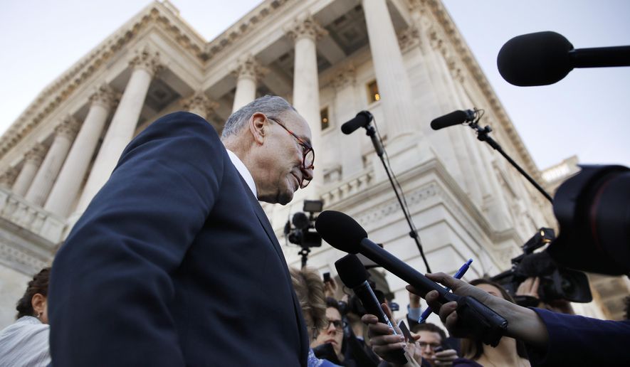 FILE - In this Friday, Jan. 19, 2018 file photo, Senate Minority Leader Chuck Schumer, D-N.Y., center, speaks to the media outside the Capitol after meeting with President Donald Trump in Washington. On Friday, Jan. 26, 2018, The Associated Press has found that stories circulating on the internet about Schumer receiving a large donation from a pro-illegal alien group before the Jan. 19 congressional vote that led to the three-day government shutdown are untrue. (AP Photo/Jacquelyn Martin)