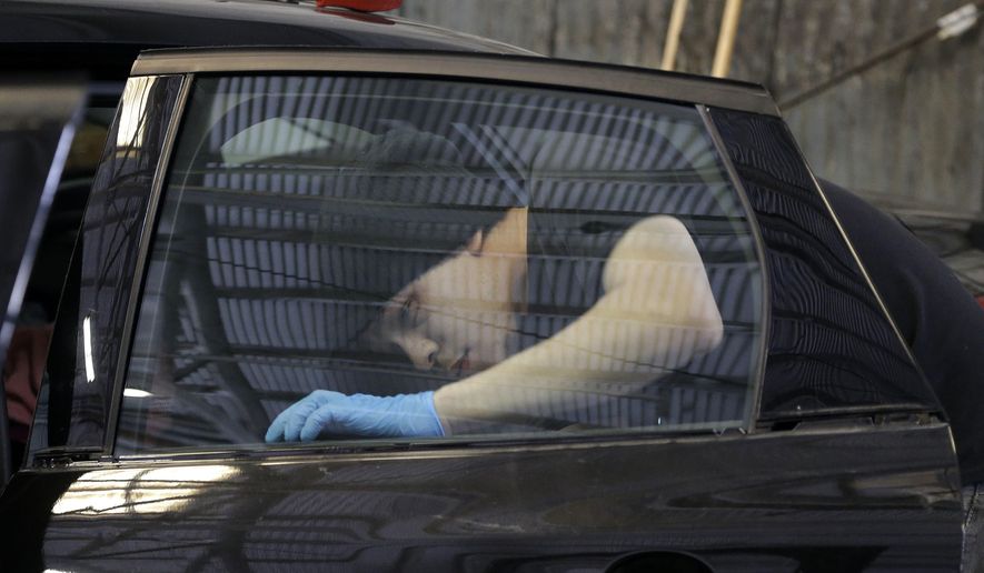 FILE - In this May 12, 2016 file photo, Jeremiah Munavu, lead technician at Auto Glass Now, installs a new window on a car in a garage in San Francisco. Across the street from San Francisco's main jail, business is booming at Auto Glass Now where annoyed motorists line up daily to get broken side windows in their vehicles replaced. Data show San Francisco police have made arrests in 13 of the more than 81,000 cases of auto break-ins reported online in the past seven years. The San Francisco Chronicle reports Friday, Jan 26, 2018, an average of 85 auto break-ins are reported in San Francisco each a day. (AP Photo/Jeff Chiu, File)