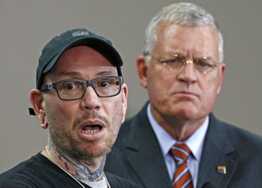 FILE - In this Jan. 24, 2017 file photo, Thomas Yoxall, left, explains the events of how he killed Leonard Pennelas-Escobar, a suspect who was beating Arizona state trooper Edward Andersson as Department of Public Safety Director Frank Milstead looks on during a news conference at DPS headquarters in Phoenix. Andersson, who was shot and brutally beaten a year ago while trying to help Pennelas-Escobar and his girlfriend in the aftermath of a rollover crash on Interstate 10 said he doesn't know why the man opened fire on him, according to newly released police reports. (AP Photo/Ross D. Franklin, File)