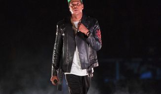 FILE - In this Nov. 26, 2017 file photo, Jay-Z performs on the 4:44 Tour at Barclays Center in New York. The rapper was nominated for eight Grammy nominations on Tuesday, Nov. 28. Four of the five album of the year nominees at the 2018 Grammys are rap and R&amp;amp;B-based albums from black or Latino artists, including Jay-Z. (Photo by Scott Roth/Invision/AP, File)