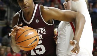 Mississippi State center Teaira McCowan (15) tries to push back against Mississippi forward Shelby Gibson (42) during the first half of the NCAA college basketball game in Oxford, Miss., Sunday, Jan. 28, 2018. Mississippi State won 69-49. (AP Photo/Rogelio V. Solis)