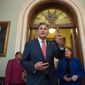Sen. Joe Manchin, D-W.Va., joined at right by Sen. Heidi Heitkamp, D-N.D., emerge from the Senate chamber just after a procedural vote aimed at reopening the government, at the Capitol in Washington, Monday, Jan. 22, 2018. Manchin, a centrist Democrat from a heavily Republican state, later met with President Donald Trump to discuss immigration. (AP Photo/J. Scott Applewhite) **FILE**