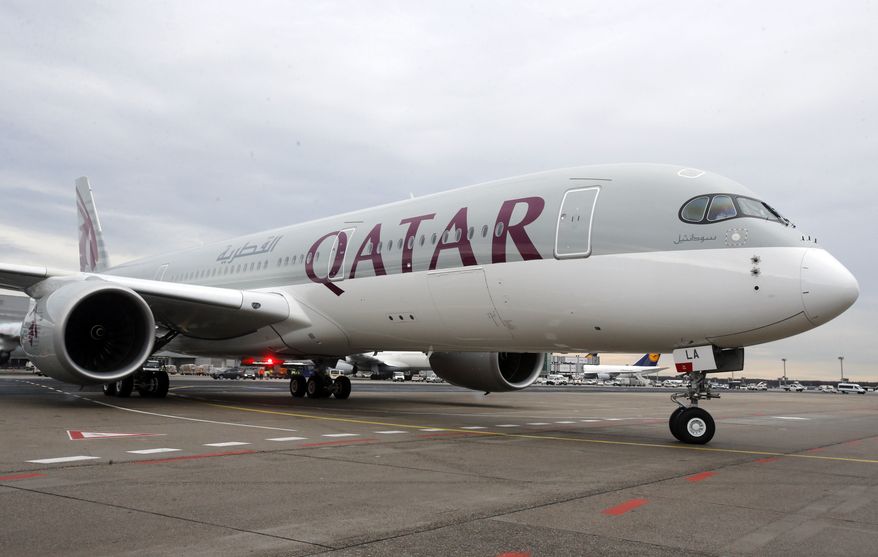 In this Jan. 15, 2015, photo, a new Qatar Airways Airbus A350 approaches the gate at the airport in Frankfurt, Germany. The United States and Qatar have reached a deal to resolve a years-old quarrel over alleged airline subsidies, seven individuals familiar with the deal said Monday, as Qatar’s government works to defuse tensions with the Trump administration. (AP Photo/Michael Probst, File)