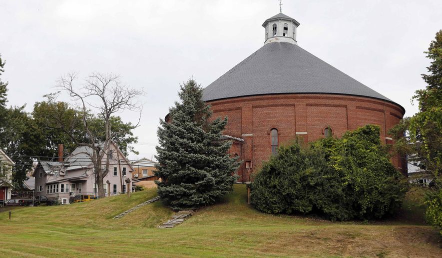 FILE - In this Oct. 2, 2015 file photo, the Concord gasholder building, built in 1888, is pictured in Concord, N.H. The 130-year-old red-brick coal gasholder building is believed to be the last of its type in the country and has been named to the National Register of Historic Places. (AP Photo/Jim Cole, File)