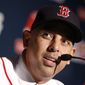 In this Nov. 6, 2017 photo, Boston Red Sox manager Alex Cora speaks after being introduced as the 47th manager and first Latino manager in the club&#39;s history in Boston. Cora is the youngest Red Sox manager in decades, and the team hopes his ability to relate to his players will help the team on the field. (AP Photo/Michael Dwyer)