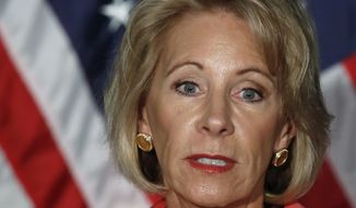 In this Sept. 7, 2017 photo, Education Secretary Betsy DeVos speaks at George Mason University Arlington, Va., campus. The Education Department&#39;s plan to provide only partial relief to some students defrauded by for-profit colleges could reduce overall payments by about 60 percent, according to a preliminary analysis obtained by The Associated Press. (AP Photo/Jacquelyn Martin)