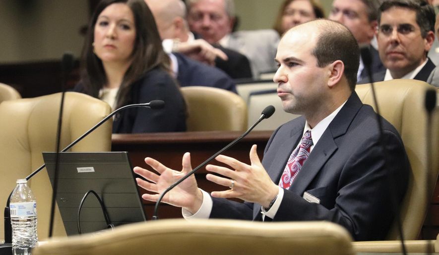 Matthew Miller, assistant director of the legal division at the Bureau of Legislative Research, speaks to legislators Tuesday, Jan. 30, 2018, in Little Rock, Ark., about a recent state Supreme Court decision restricting lawsuits against the state. Some are concerned the ruling could increase demands on the state Claims Commission, which considers financial claims against Arkansas. (AP Photo/Kelly P. Kissel)